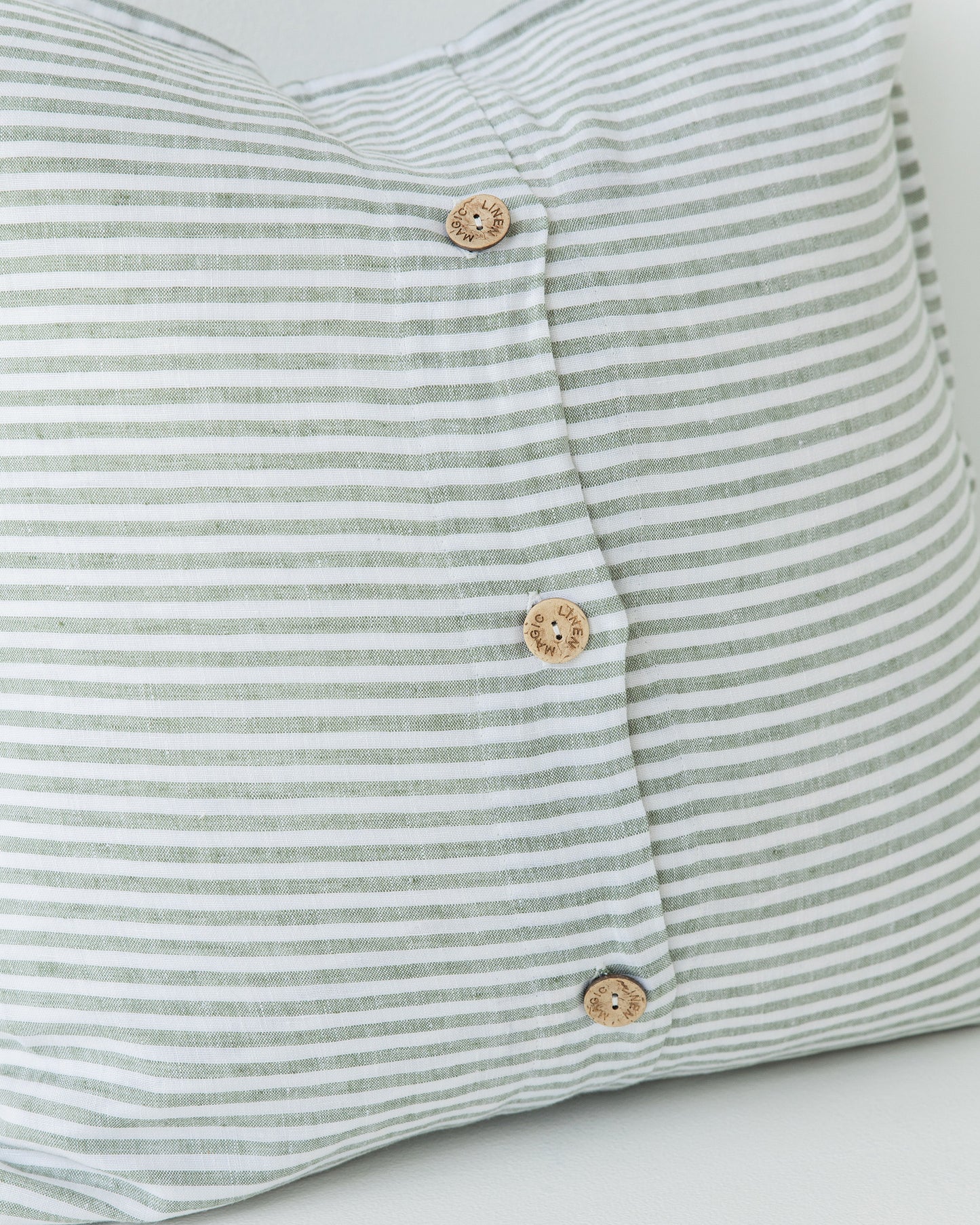 Deco Pillow Cover With Buttons in Striped in Forest Green | MagicLinen