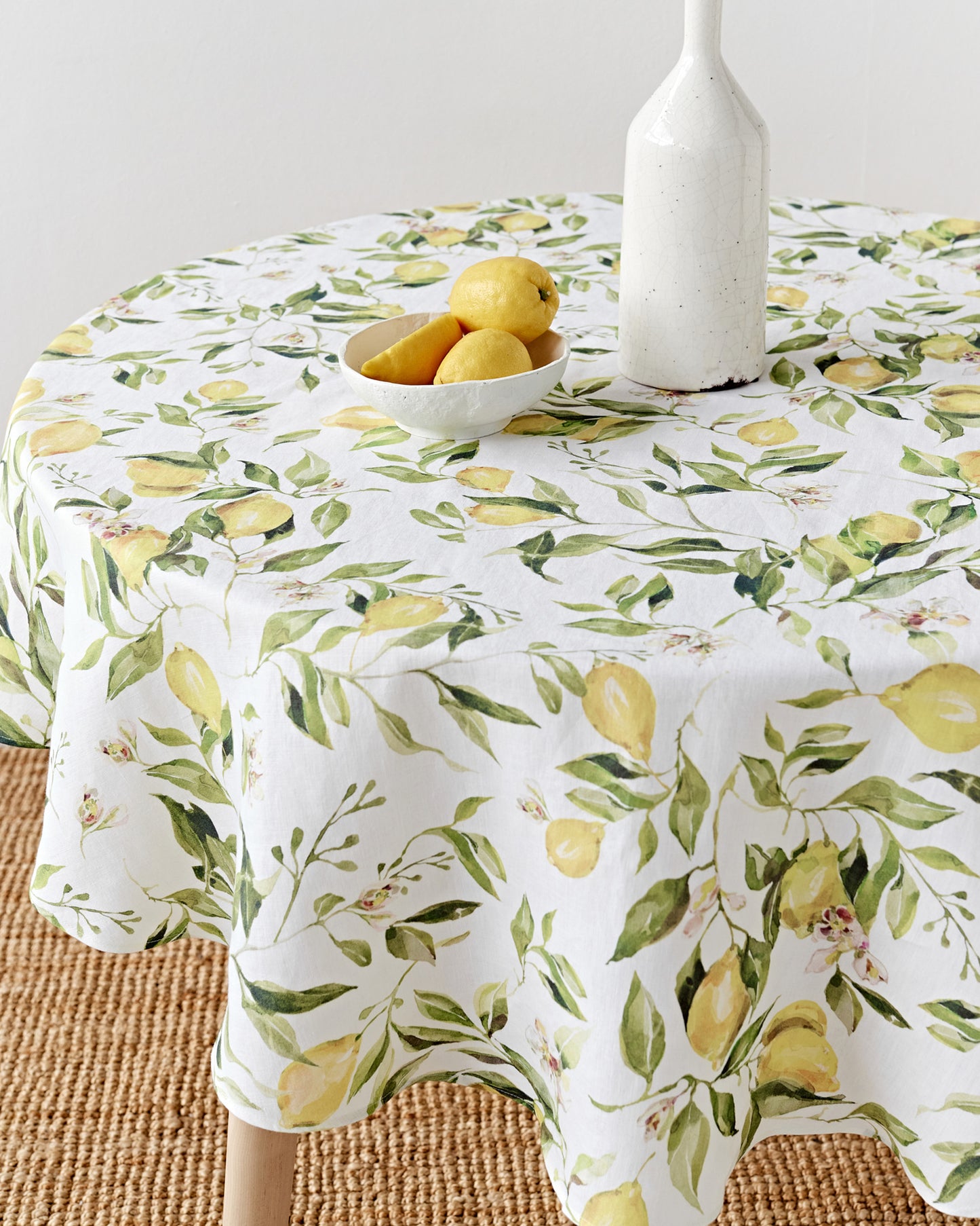 Round linen tablecloth in Citrus garden print on white | MagicLinen
