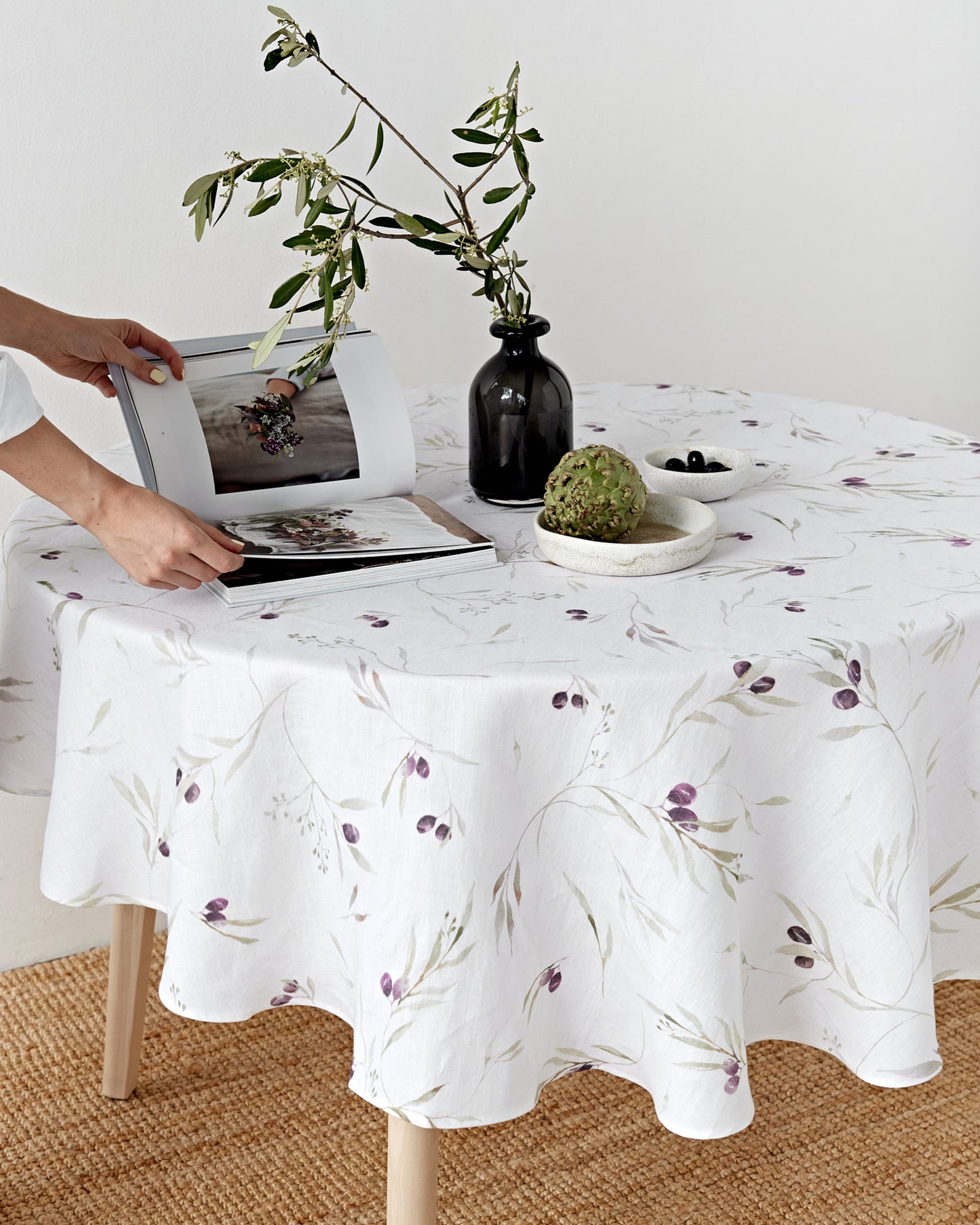 Round linen tablecloth in Olive orchard print on white | MagicLinen