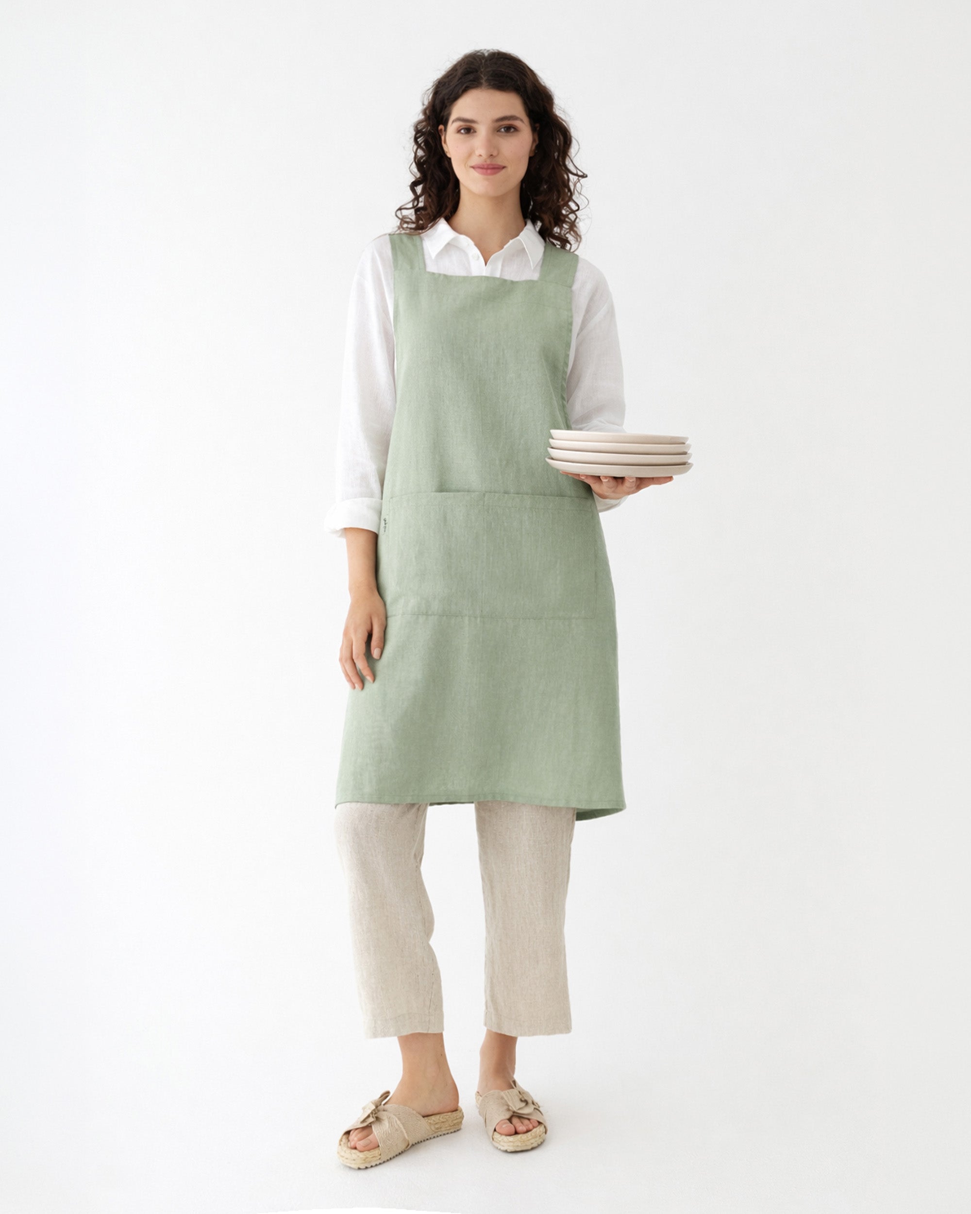 Pinafore cross-back linen apron in Sage green | MagicLinen