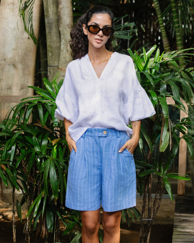Pleated linen shorts BAGAN in Blue stripes - MagicLinen modelBoxOn2