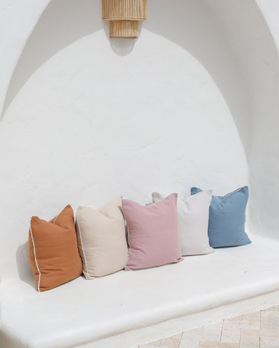 Cushion cover with pom poms in Woodrose - MagicLinen