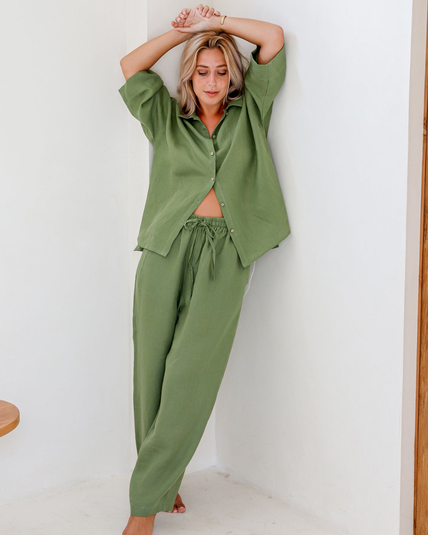MagicLinen Forest Green pajama set paired with Natural linen robe in soft morning light