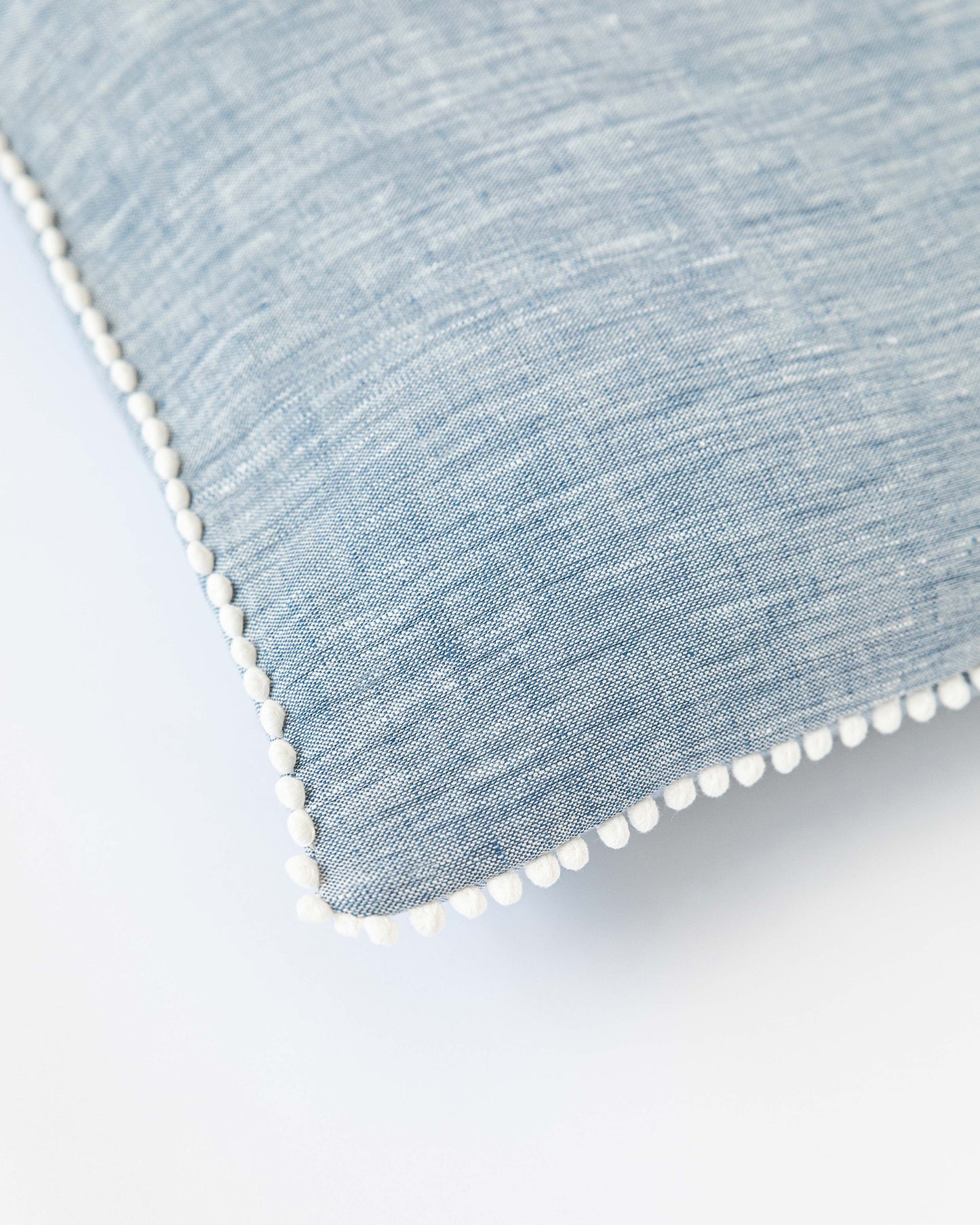 Cushion cover with pom poms in Blue melange - MagicLinen