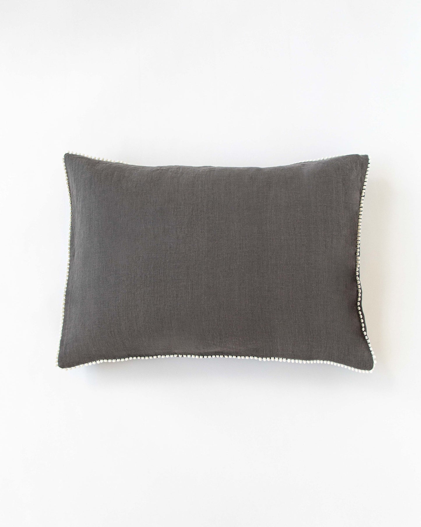 Pom pom trim linen pillowcase in Charcoal gray - MagicLinen