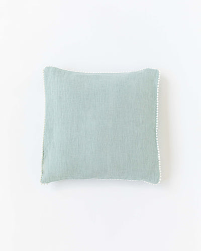 Cushion cover with pom poms in Dusty blue - MagicLinen