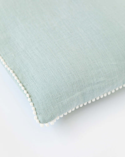 Cushion cover with pom poms in Dusty blue - MagicLinen