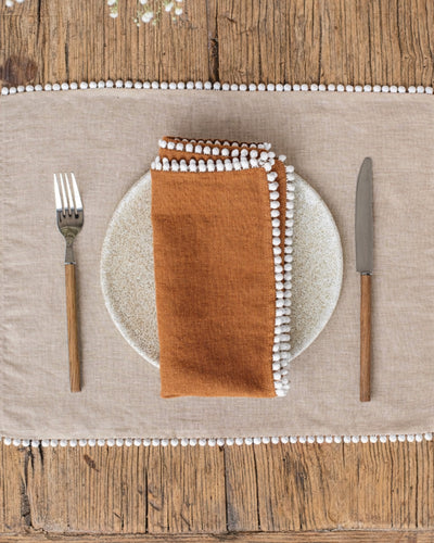 Pom pom trim linen napkin set of 2 in Cinnamon