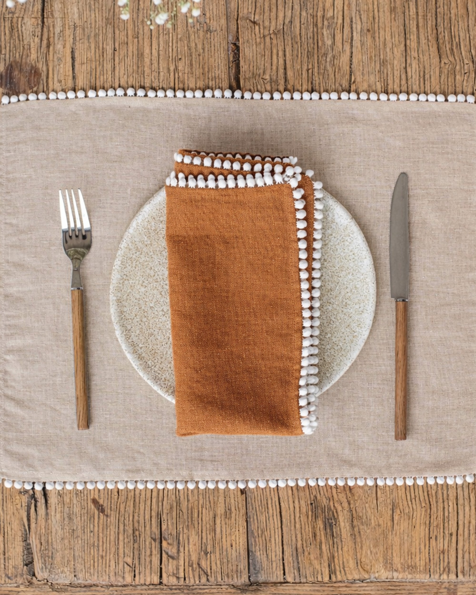 Pom pom trim linen napkin set 2 Cinnamon