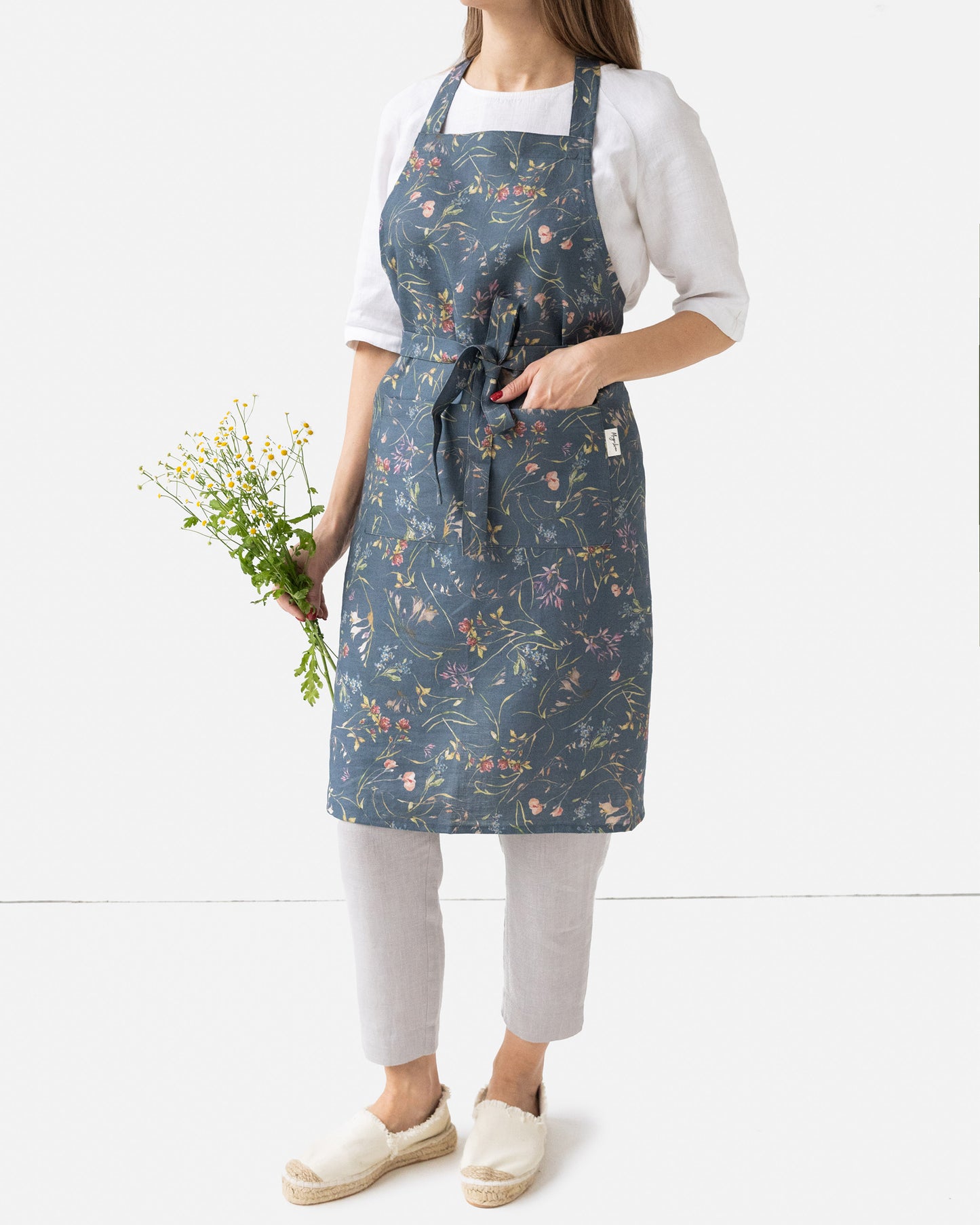 Linen bib apron in Wildflowers print on deep navy blue | MagicLinen