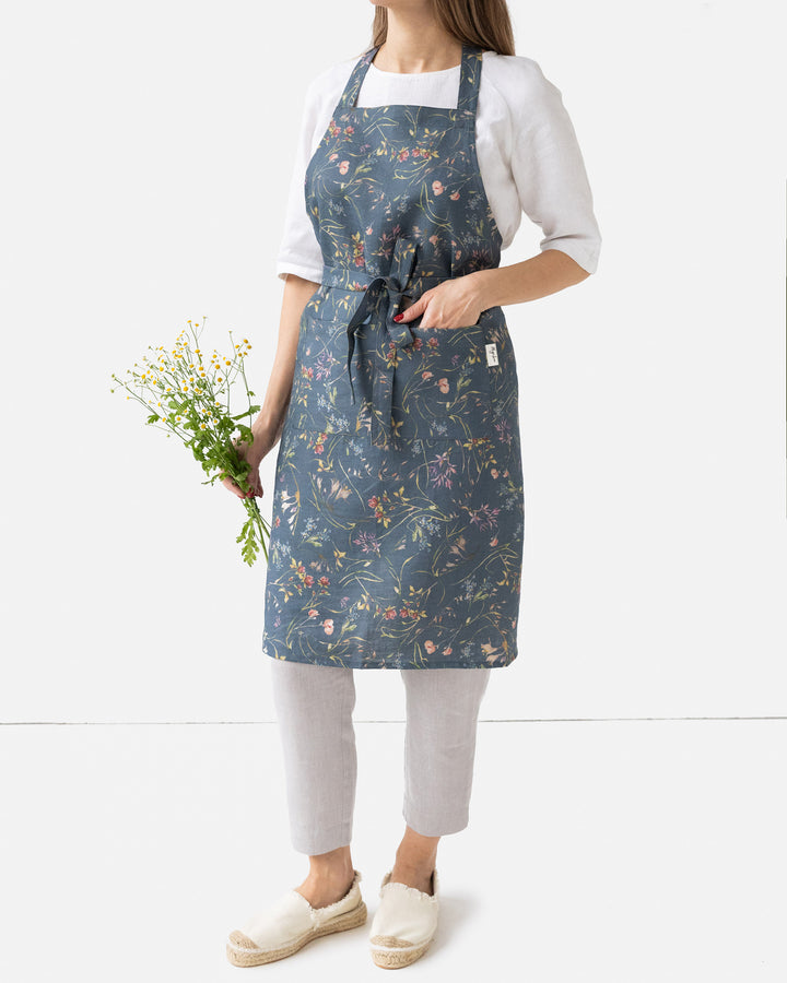 Linen bib apron in Wildflowers print on deep navy blue | MagicLinen