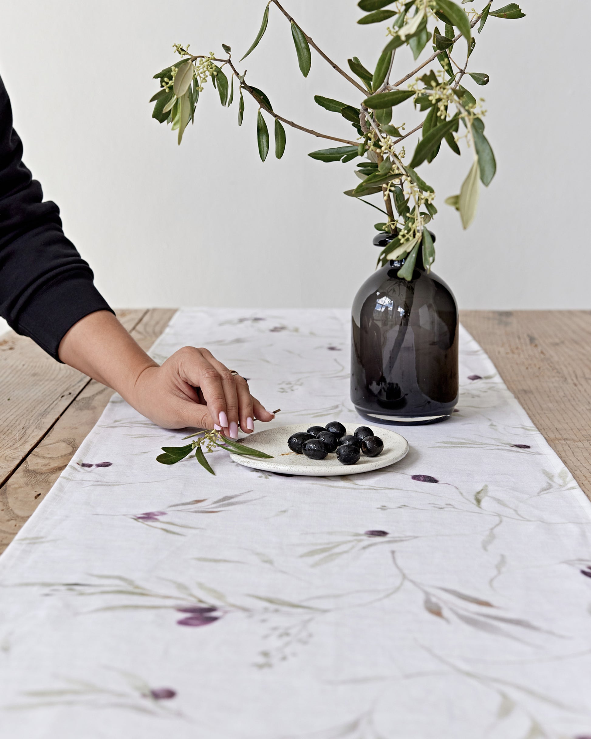 Linen Table Runner in Olive orchard print on white | MagicLinen