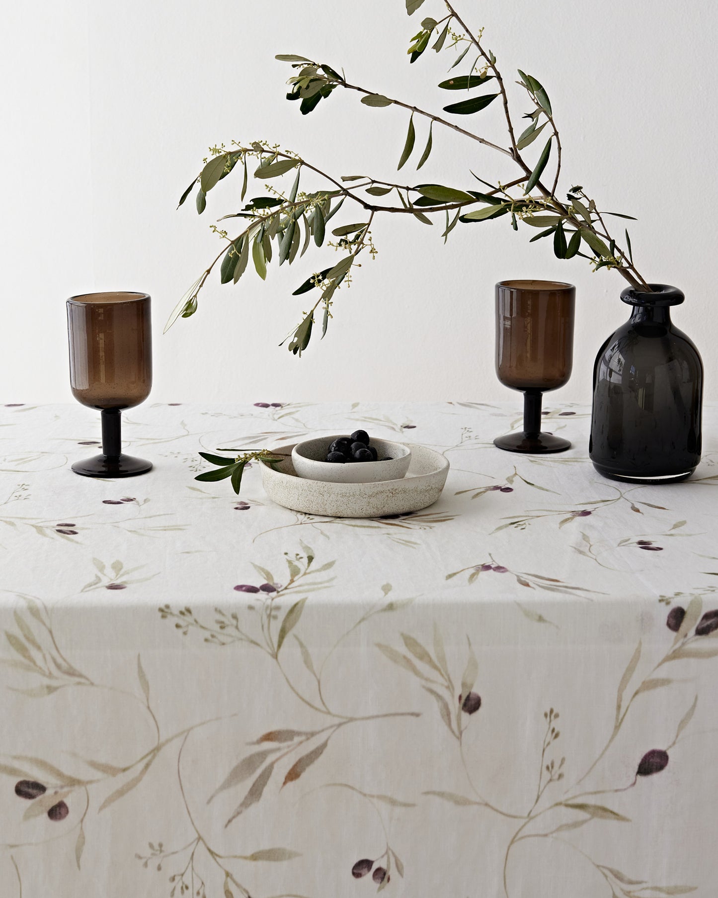 Olive orchard print on white linen tablecloth | MagicLinen