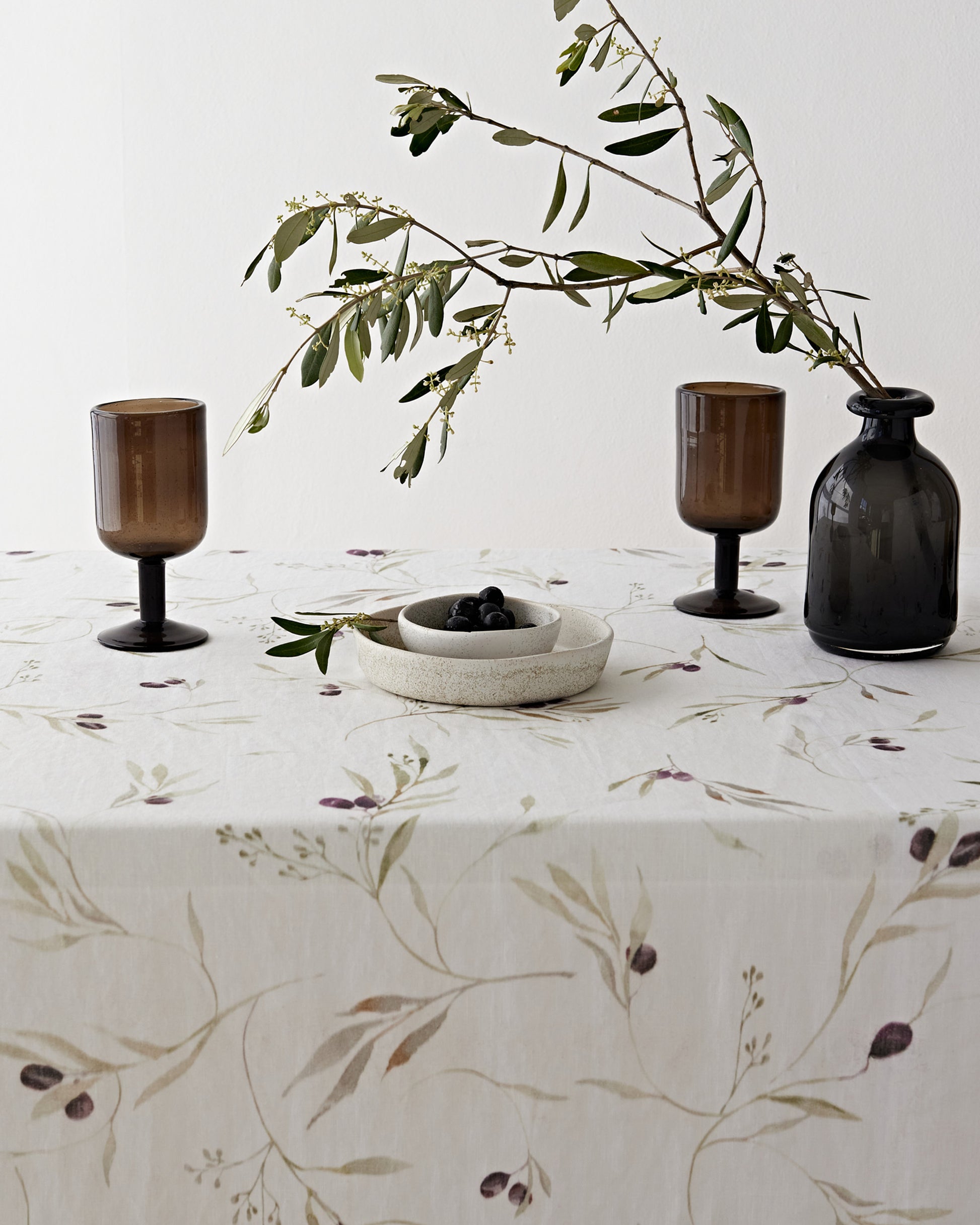 Olive orchard print on white linen tablecloth | MagicLinen