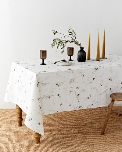 Olive orchard print on white linen tablecloth | MagicLinen