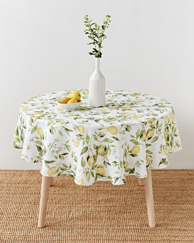 Round linen tablecloth in Citrus garden print on white | MagicLinen