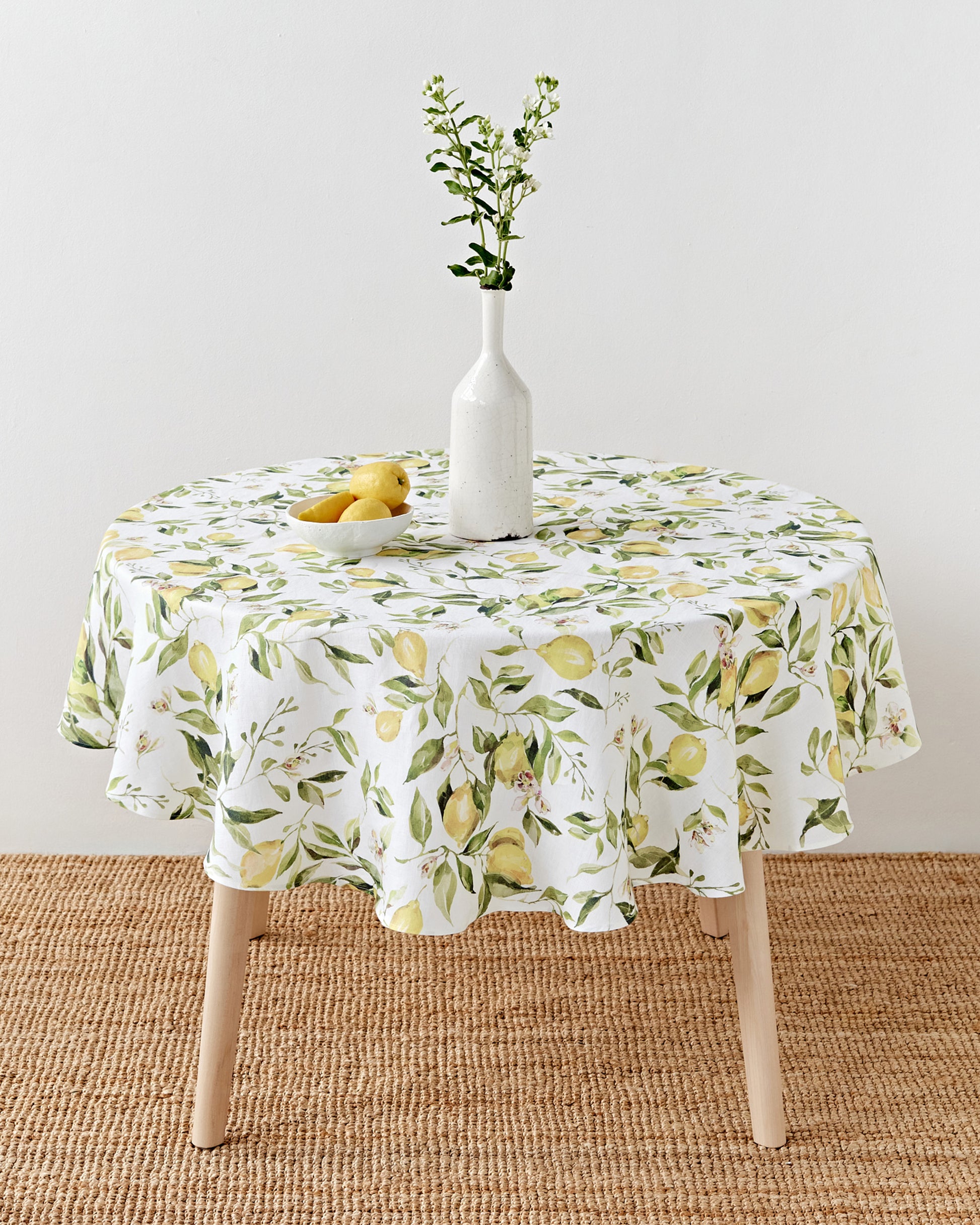 Round linen tablecloth in Citrus garden print on white | MagicLinen