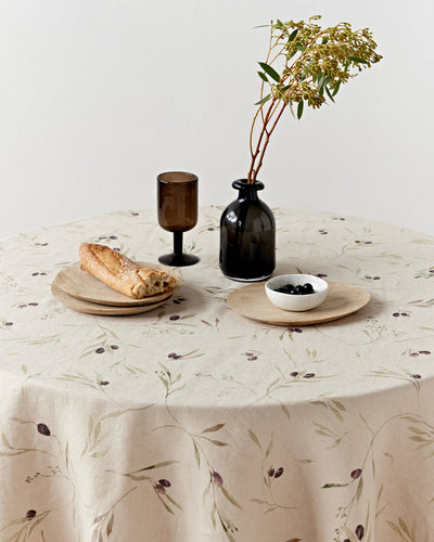 Round linen tablecloth in Olive orchard print on natural | MagicLinen
