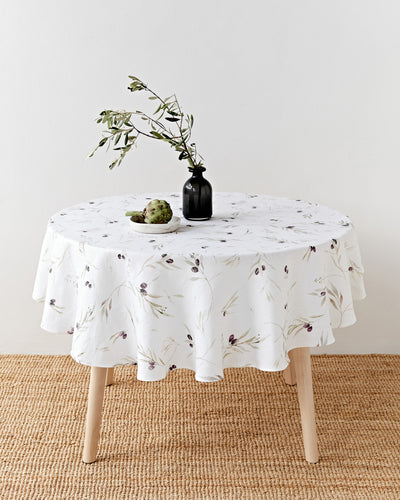 Round linen tablecloth in Olive orchard print on white | MagicLinen