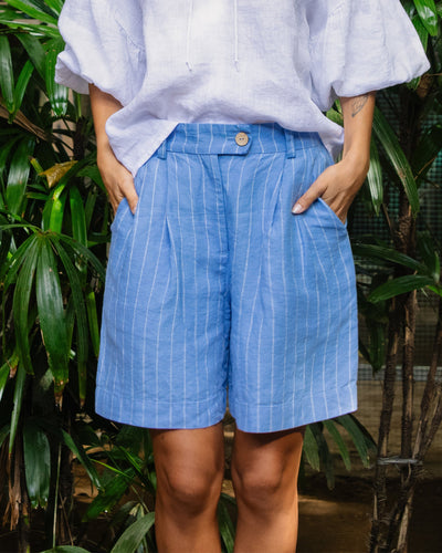 Pleated linen shorts BAGAN in Blue stripes - MagicLinen modelBoxOn2