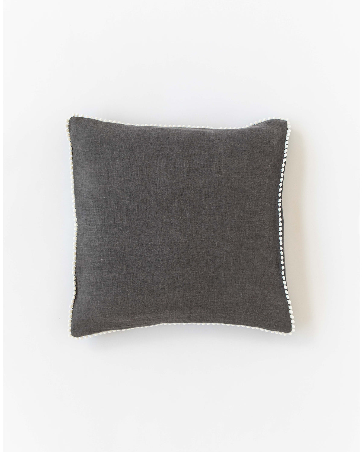 Cushion cover pom poms