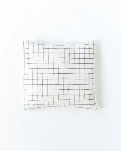 Cushion cover with pom poms in Charcoal grid - MagicLinen