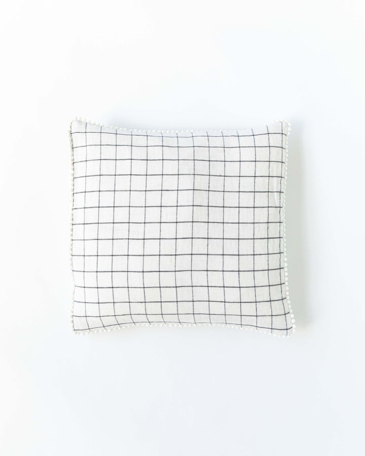 Cushion cover with pom poms in Charcoal grid - MagicLinen