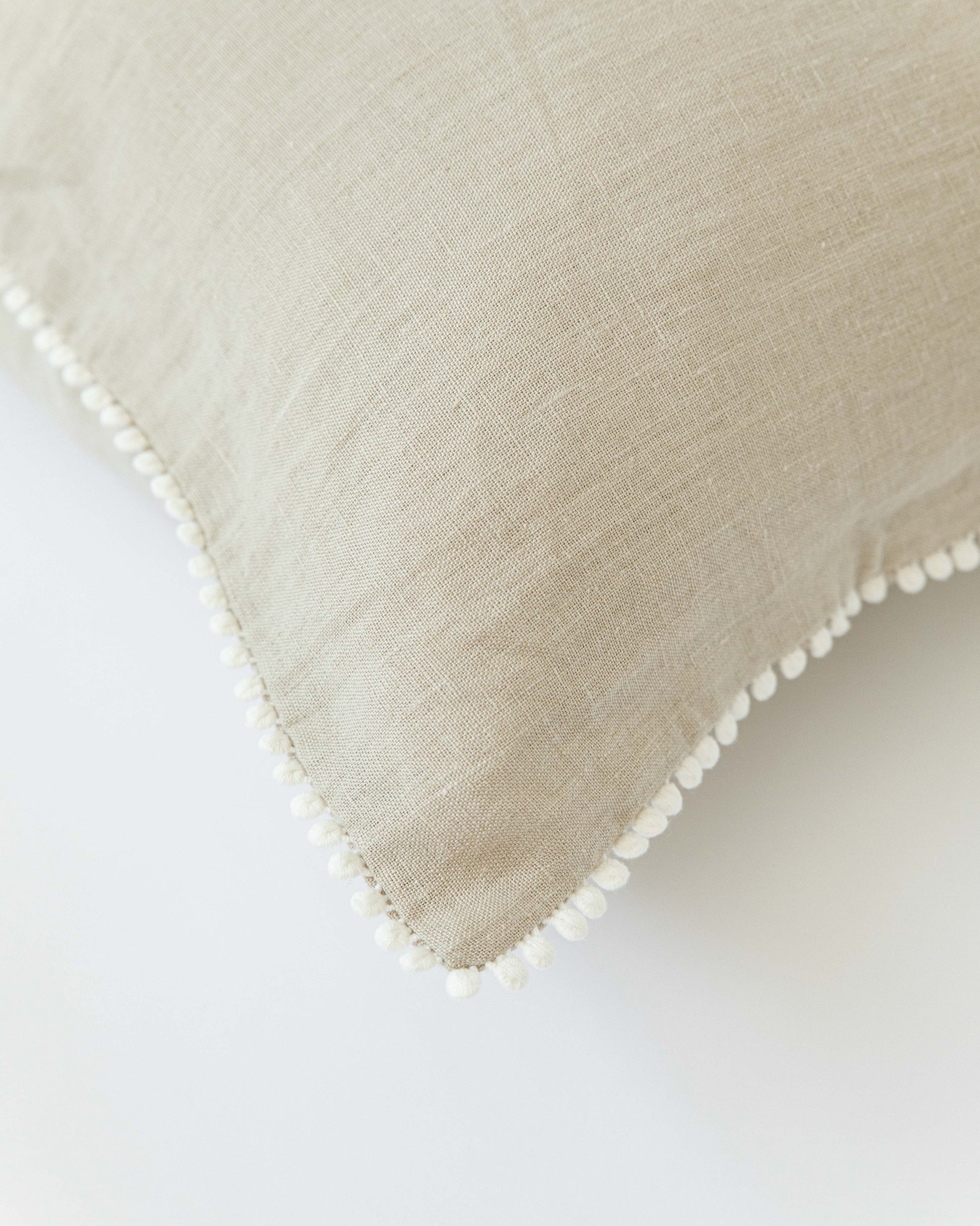 Cushion cover with pom poms in Natural linen - MagicLinen