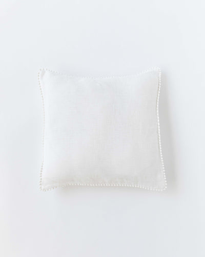 Cushion cover with pom poms in White - MagicLinen