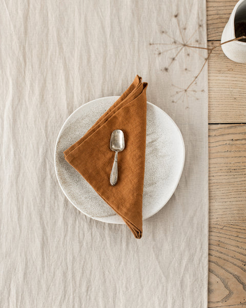 https://magiclinen.com/cdn/shop/products/set-of-cinnamon-linen-napkins-1_grande.jpg?v=1674739733