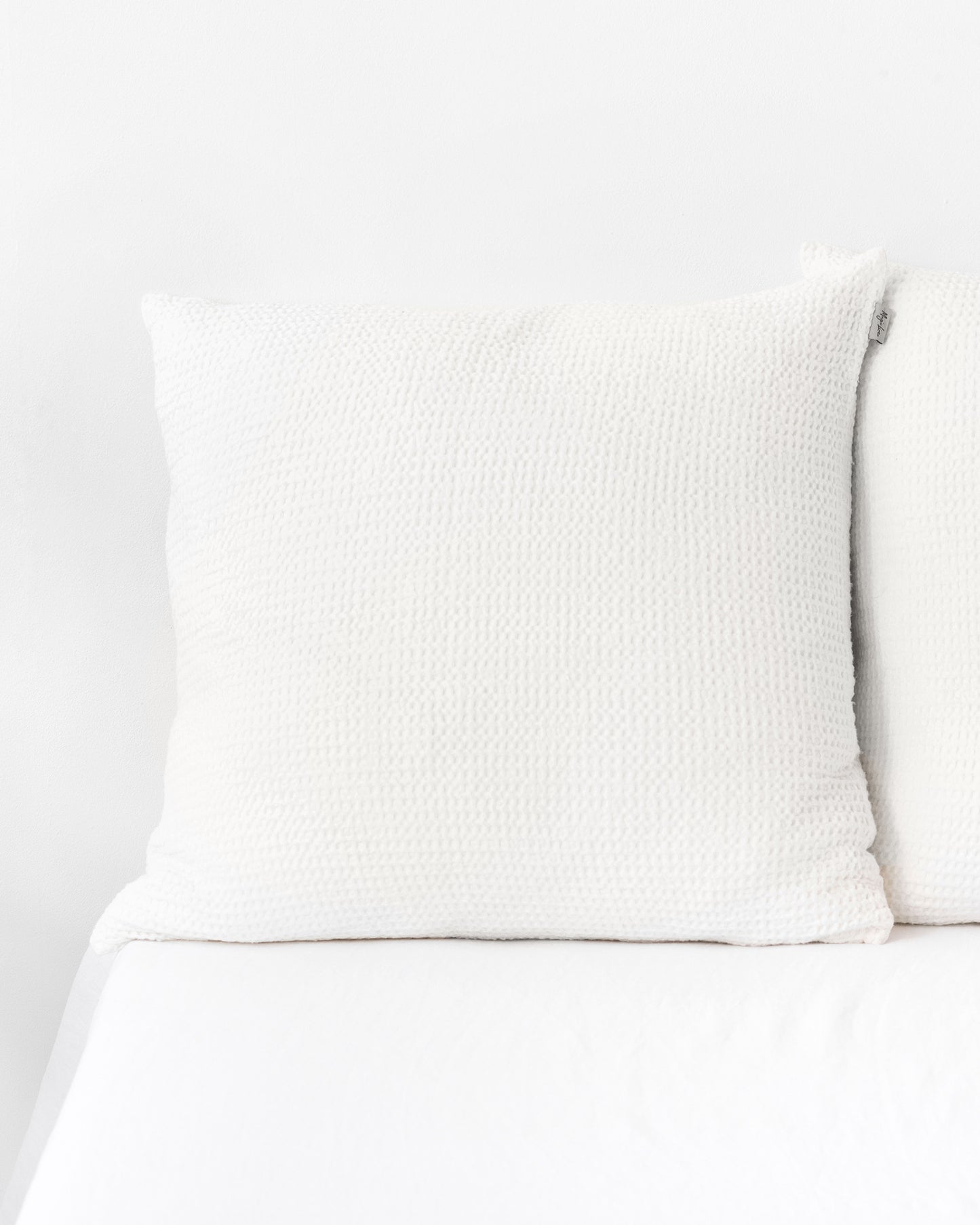 https://magiclinen.com/cdn/shop/products/waffle-throw-pillow-cover-in-white-0.jpg?v=1676989100&width=1445
